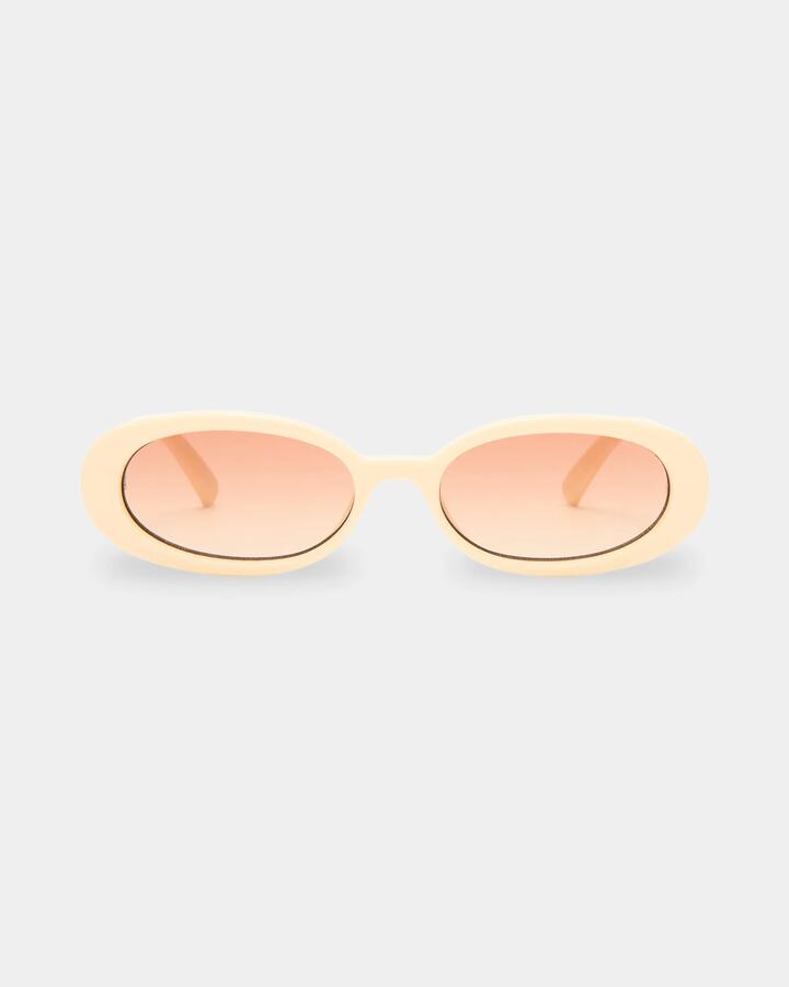 Image of Sunglasses. Productname: Le Specs Outta Love Ecru Oval Sunglasses Warm Brown Grad - in Warm Brown Grad colour by brand - Le Specs