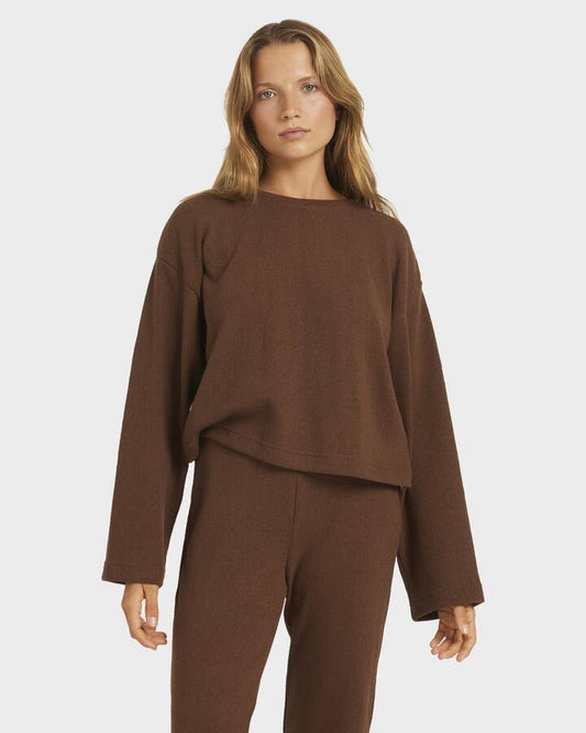 Image of a model wearing Tops. Productname: Roxy Womens Stay Cozy Knit Crew Fondue Fudge - in Fondue Fudge colour by brand - Roxy