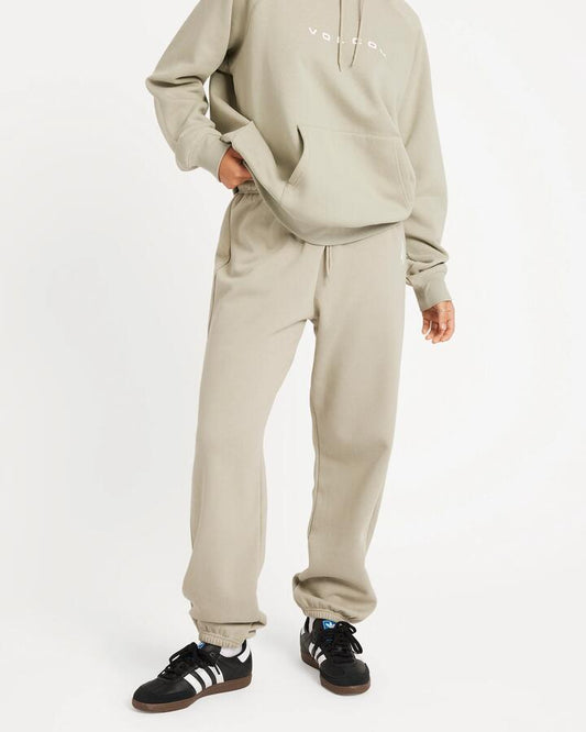 Image of a model wearing Pants. Productname: Volcom Womens Get More Track Pants Sea Glass - in Sea Glass colour by brand - Volcom