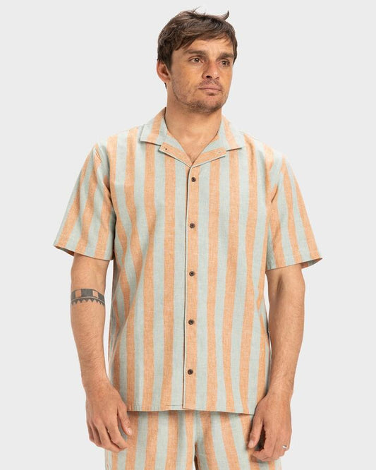 Image of a model wearing Tops. Productname: Quiksilver Mens Sunset Song Short Sleeve Shirt Bran Sunset Song - in Bran Sunset Song colour by brand - Quiksilver