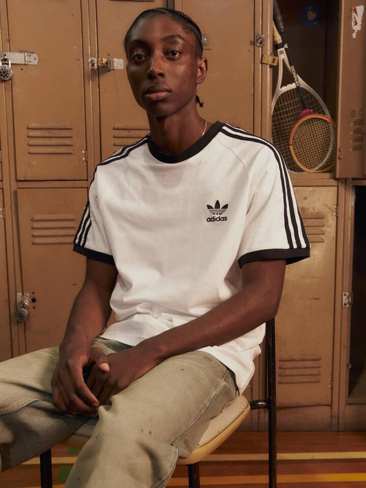 Image of a model wearing Tops. Productname: Adidas Adicolor Classics 3 Stripes T-Shirt in White colour by brand - Adidas