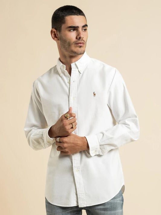 Image of a model wearing Tops. Productname: Polo Ralph Lauren Custom Fit Button Up Shirt in White colour by brand - Polo Ralph Lauren