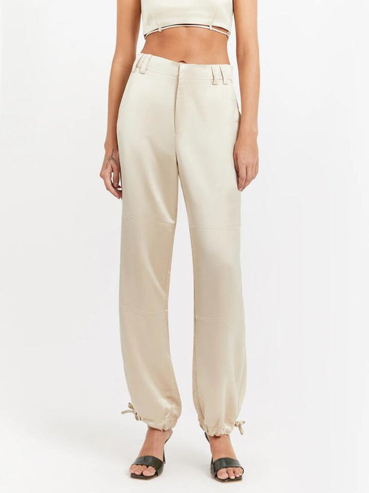 Image of a model wearing Pants. Productname: First Mse Aster Satin Pants in Ivory colour by brand - First Mse