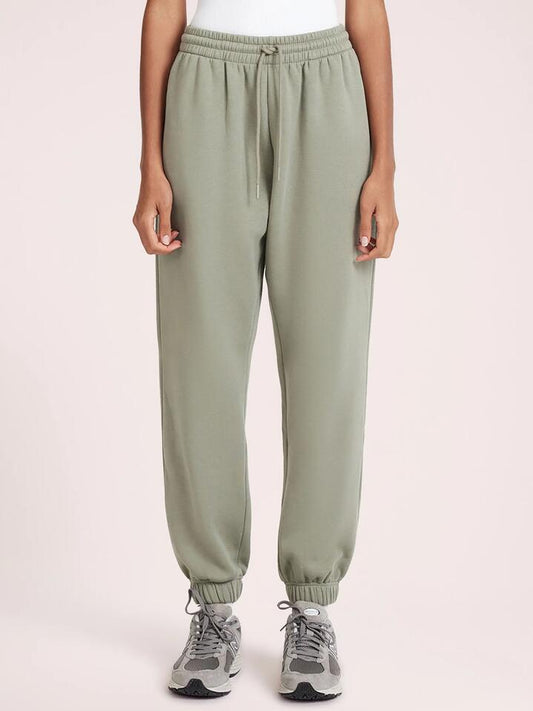 Image of a model wearing Pants. Productname: Nude Lucy Carter Curated Trackpant in Fog colour by brand - Nude Lucy