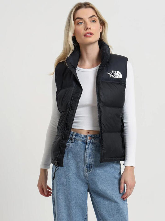Image of a model wearing Tops. Productname: The North Face 1996 Retro Nuptse Vest in Tnf Black colour by brand - The North Face