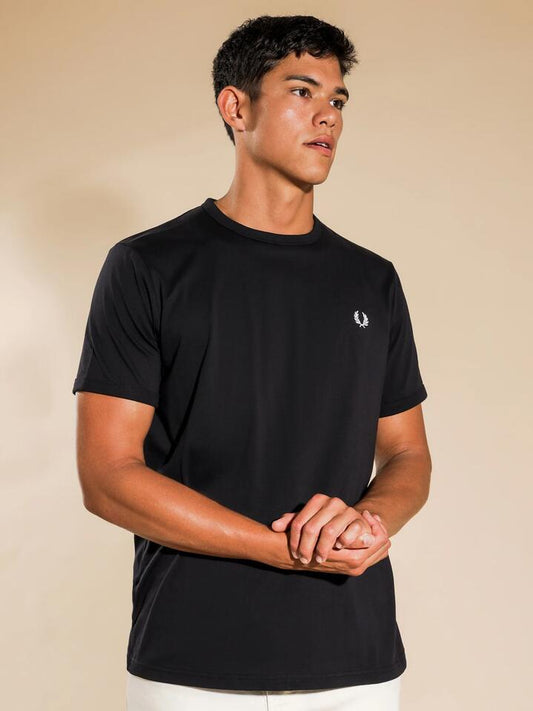 Image of a model wearing Tops. Productname: Fred Perry Ringer T-Shirt in Navy colour by brand - Fred Perry