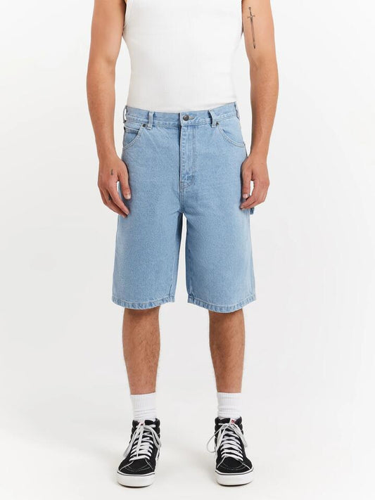 Image of a model wearing Denim. Productname: Dickies 11' Relaxed Fit Carpenter Denim Shorts in Light Indigo colour by brand - Dickies