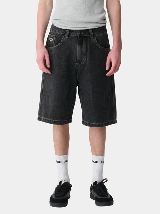 Image of a model wearing Shorts. Productname: Xlarge Bull Denim 91 Shorts in Black colour by brand - Xlarge