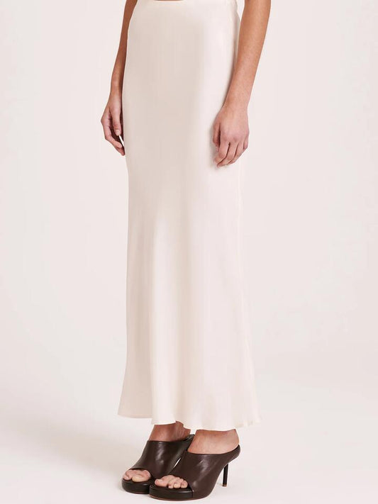 Image of a model wearing Skirts. Productname: Nude Lucy Ines Cupro Skirt in Cloud colour by brand - Nude Lucy