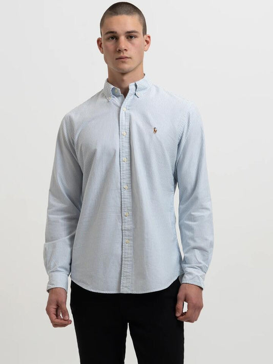 Image of a model wearing Tops. Productname: Polo Ralph Lauren Long Sleeve Button Up Shirt in Blue/White colour by brand - Polo Ralph Lauren