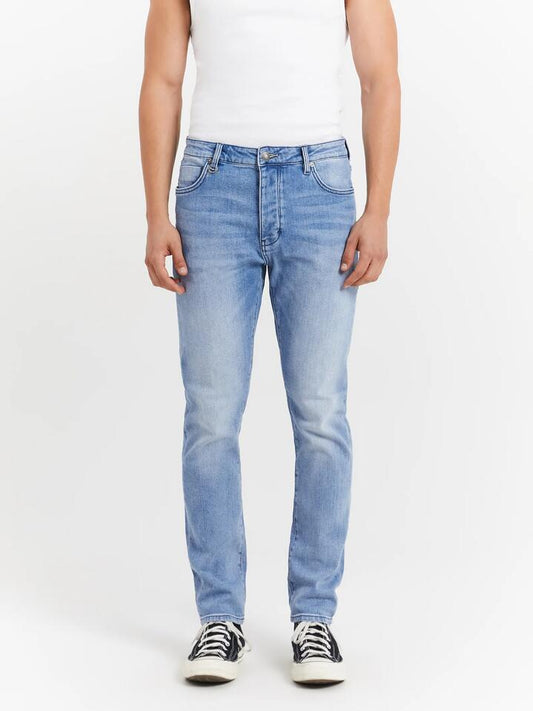 Image of a model wearing Denim. Productname: Neuw Lou Slim Jeans in Fazer colour by brand - Neuw