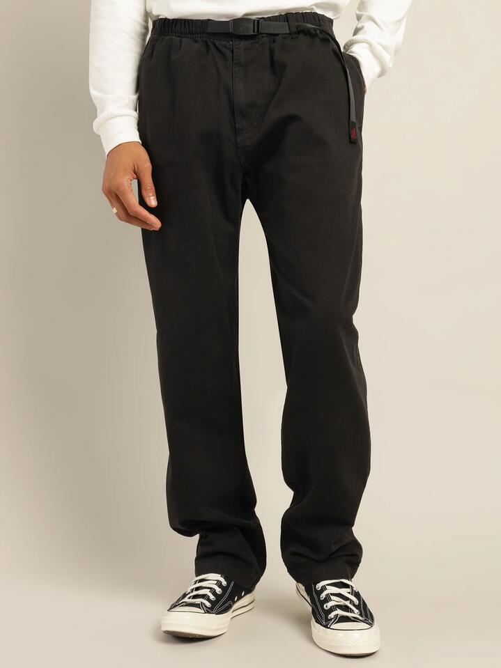 Image of a model wearing Pants. Productname: Gramicci Gramicci Pants in Black colour by brand - Gramicci