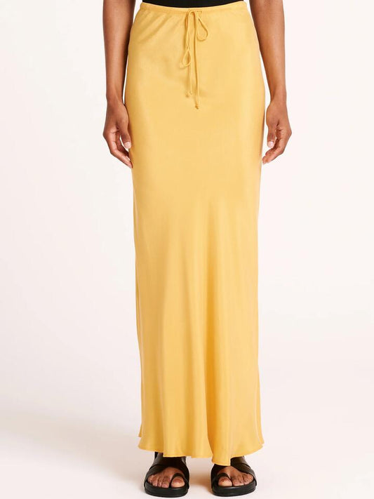 Image of a model wearing Skirts. Productname: Nude Lucy Lea Cupro Skirt in Marigold colour by brand - Nude Lucy