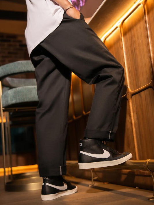 Image of a model wearing Pants. Productname: Dickies 874 Original Unisex Work Pants in Black colour by brand - Dickies