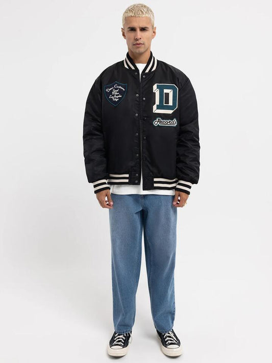 Image of a model wearing Outerwear. Productname: Deus Sophomore 2.0 Varsity Jacket in Black colour by brand - Deus