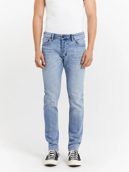 Image of a model wearing Denim. Productname: Neuw Ray Tapered Jeans in Super Sonic colour by brand - Neuw