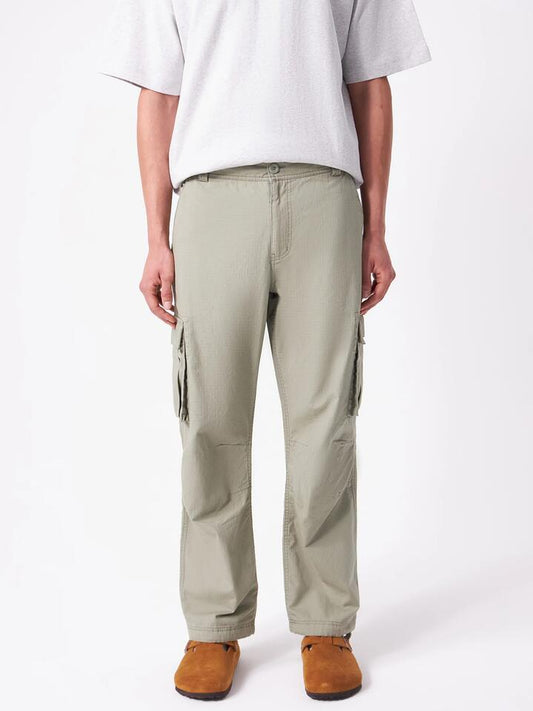 Image of a model wearing Pants. Productname: Article One Wyatt Cargo Pants in Willow colour by brand - Article One