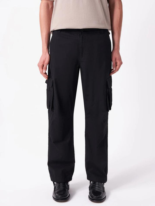 Image of a model wearing Pants. Productname: Article One Wyatt Cargo Pants in Black colour by brand - Article One