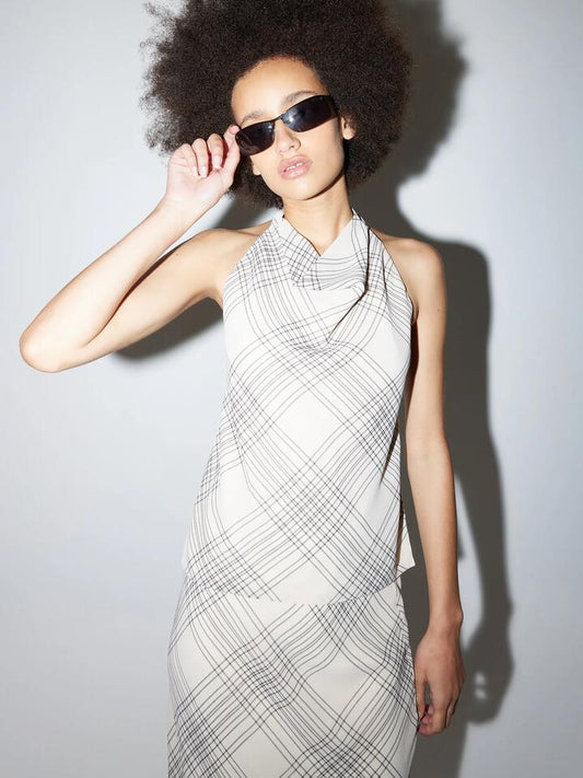 Image of a model wearing Tops. Productname: Beyond Her Tash Halter Top in Crossroads colour by brand - Beyond Her