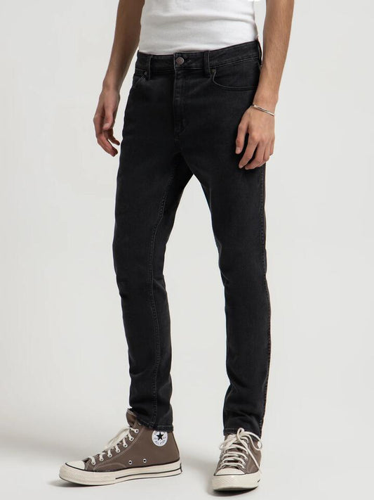 Image of a model wearing Denim. Productname: Wrangler Sid Jean in Black colour by brand - Wrangler