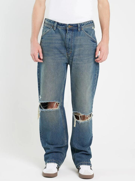 Image of a model wearing Denim. Productname: Abrand A5 Baggy Sam Rip in Dark Vintage Indigo colour by brand - Abrand