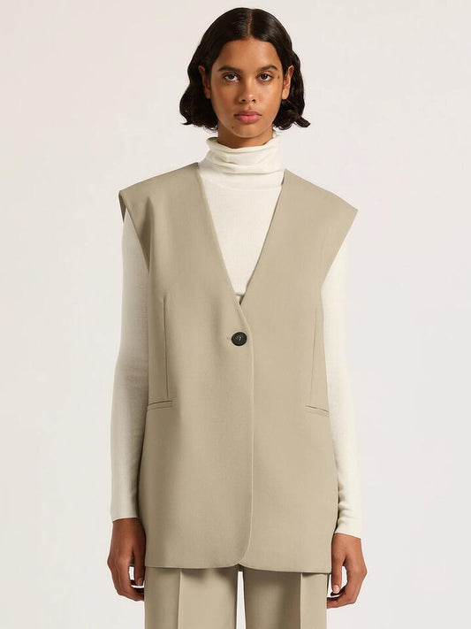 Image of a model wearing Tops. Productname: Nude Lucy Theo Tailored Vest in Sage colour by brand - Nude Lucy
