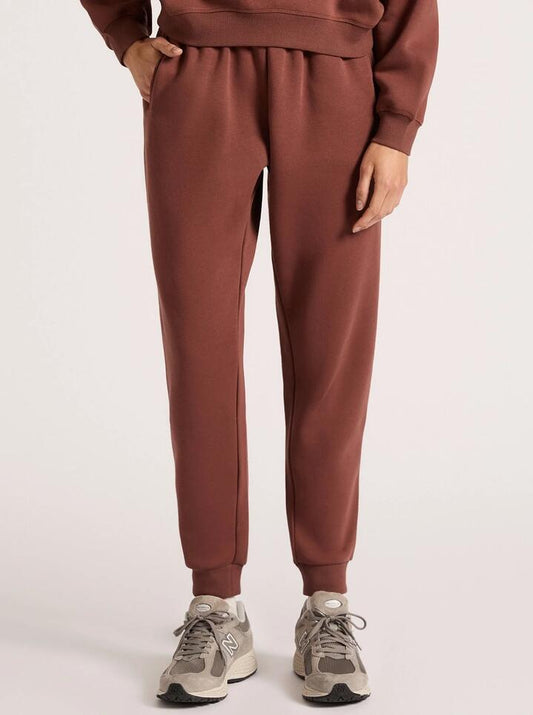 Image of a model wearing Pants. Productname: Nude Lucy Carter Classic Trackpant in Wine colour by brand - Nude Lucy