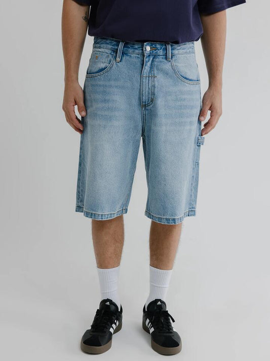 Image of a model wearing Shorts. Productname: Thrills Big Slacker Lifted Embro Shorts in Dirty Weathered Blue colour by brand - Thrills