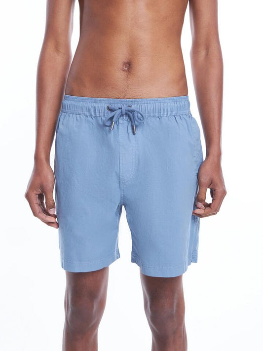 Image of a model wearing Shorts. Productname: Article One Bryce Swim Shorts in Washed Sea Blue colour by brand - Article One