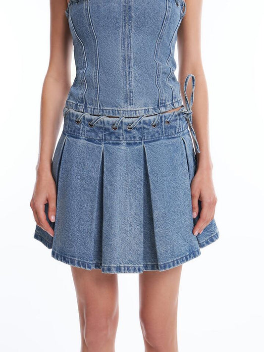 Image of a model wearing Skirts. Productname: Beyond Her Gigi Pleated Mini Skirt in Aged Indigo colour by brand - Beyond Her