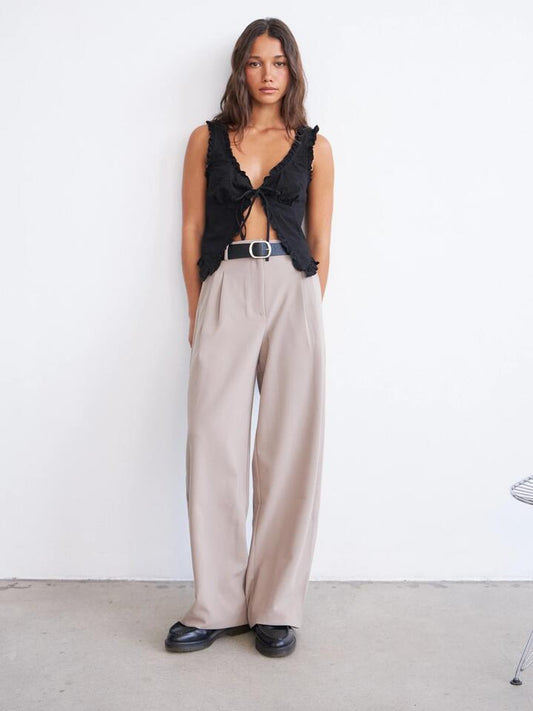Image of a model wearing Pants. Productname: Nude Lucy Jiro Tailored Pant in Taupe colour by brand - Nude Lucy