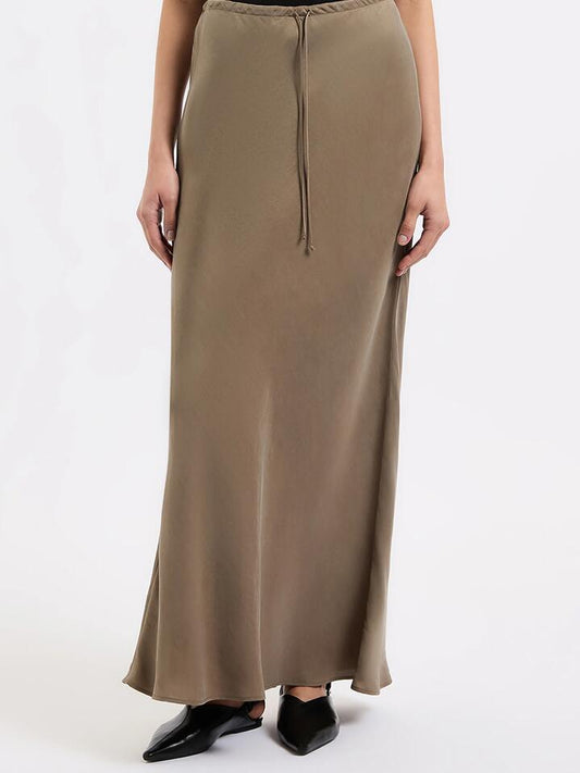 Image of a model wearing Skirts. Productname: Nude Lucy Seshni Tencel Maxi Skirt in Chestnut colour by brand - Nude Lucy