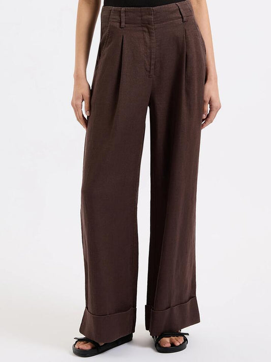Image of a model wearing Pants. Productname: Nude Lucy Paloma Tailored Pant in Espresso colour by brand - Nude Lucy