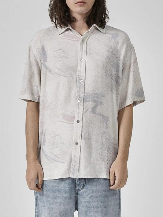 Image of a model wearing Shorts. Productname: Thrills Plasma Dream Short Sleeve Shirt in White colour by brand - Thrills