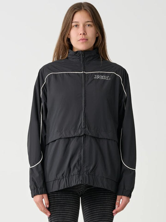 Image of a model wearing Outerwear. Productname: Xgirl Panelled Track Jacket in Black colour by brand - Xgirl