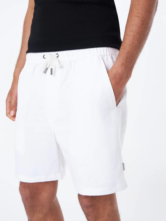 Image of a model wearing Shorts. Productname: Article One Luca Linen Short in White colour by brand - Article One