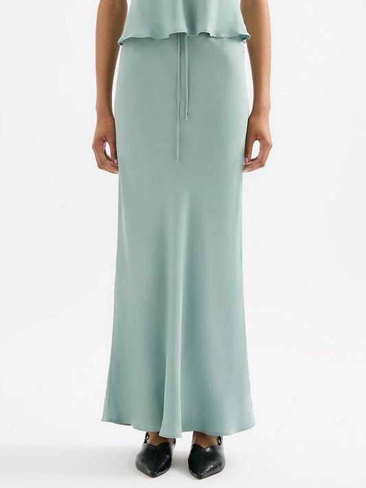 Image of a model wearing Skirts. Productname: Nude Lucy Lea Cupro Skirt in Capri colour by brand - Nude Lucy