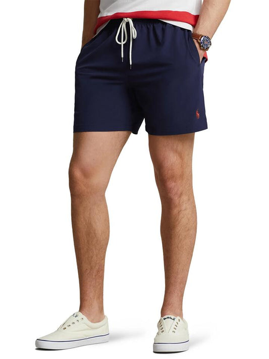 Image of a model wearing Shorts. Productname: Polo Ralph Lauren Traveler Swim Short in Navy colour by brand - Polo Ralph Lauren
