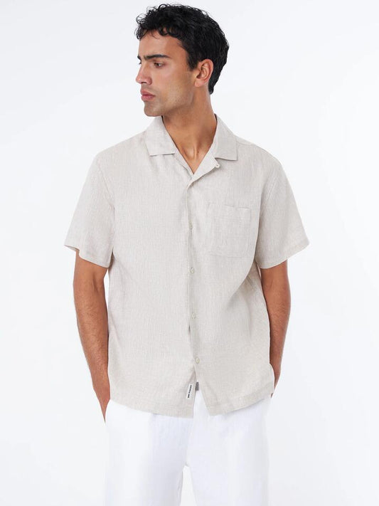 Image of a model wearing Tops. Productname: Article One Luca Linen Resort Shirt in Natural colour by brand - Article One