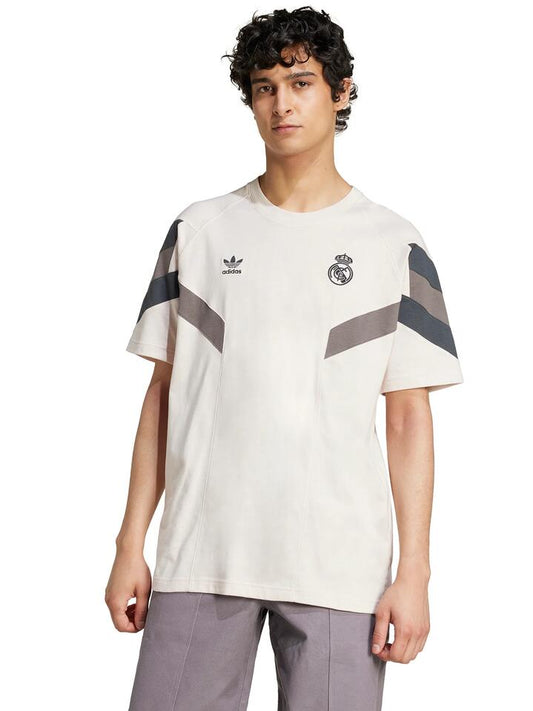 Image of a model wearing Tops. Productname: Adidas Real Madrid OG T-Shirt in Putty Mauve/Dark colour by brand - Adidas