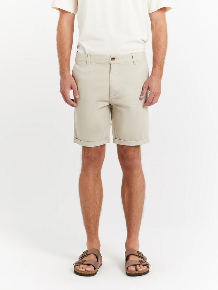 Image of a model wearing Pants. Productname: Article One Ellis Chino Short in Stone colour by brand - Article One