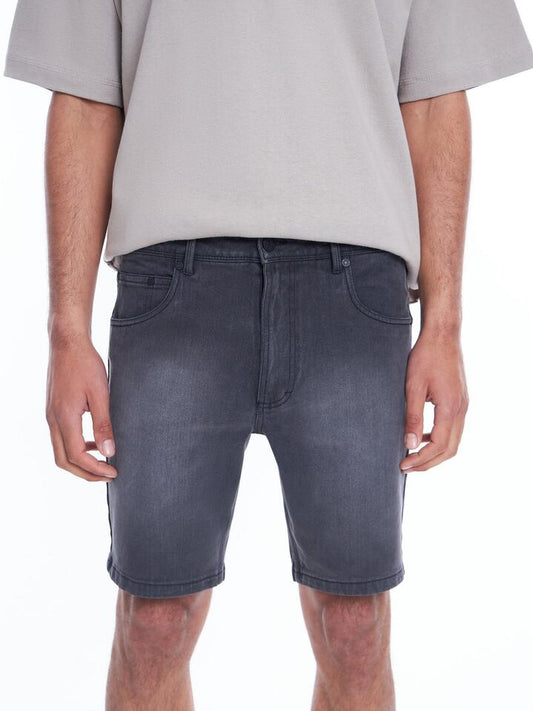 Image of a model wearing Denim. Productname: Article One Zane Skinny Denim Short in Smokey Black colour by brand - Article One