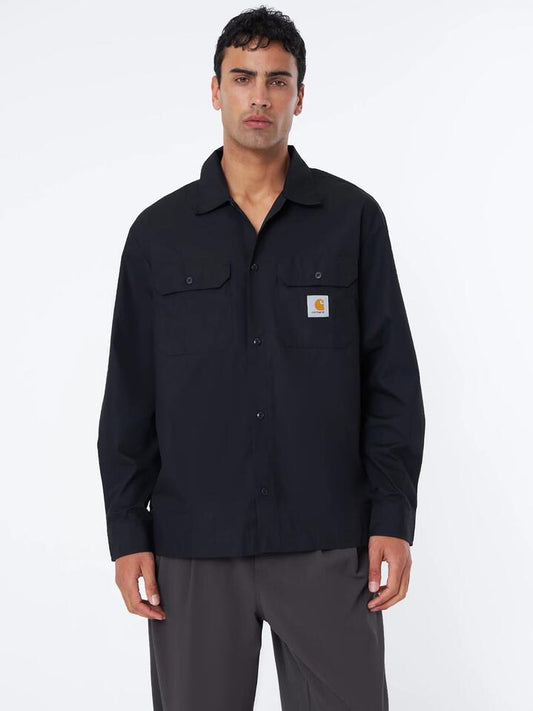 Image of a model wearing Tops. Productname: Carhartt Wip Long Sleeve Craft Shirt in Black colour by brand - Carhartt Wip