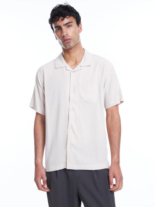 Image of a model wearing Tops. Productname: Article One Levi Shirt in Ecru colour by brand - Article One