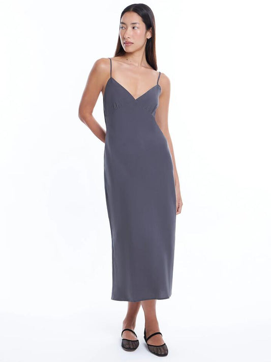 Image of a model wearing Dress. Productname: Lulu & Rose Paula Midi Dress in Coal colour by brand - Lulu & Rose
