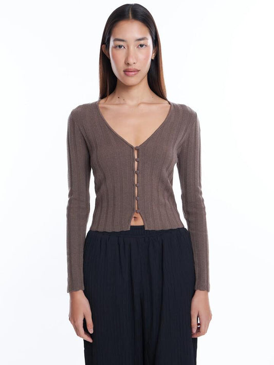 Image of a model wearing Outerwear. Productname: Lulu & Rose Sylvie Cropped Cardi in Brownie colour by brand - Lulu & Rose