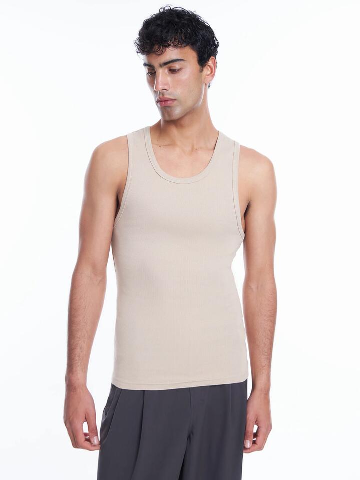 Image of a model wearing Tops. Productname: Article One Classic Singlet in Stone colour by brand - Article One