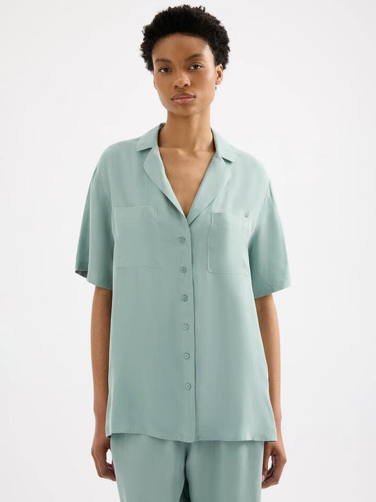 Image of a model wearing Tops. Productname: Nude Lucy Lucia Cupro Shirt in Capri colour by brand - Nude Lucy