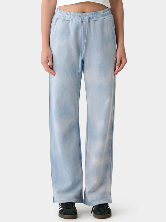 Image of a model wearing Pants. Productname: Xgirl 94 Wide Leg Trackpant in Blue Tie Dye colour by brand - Xgirl