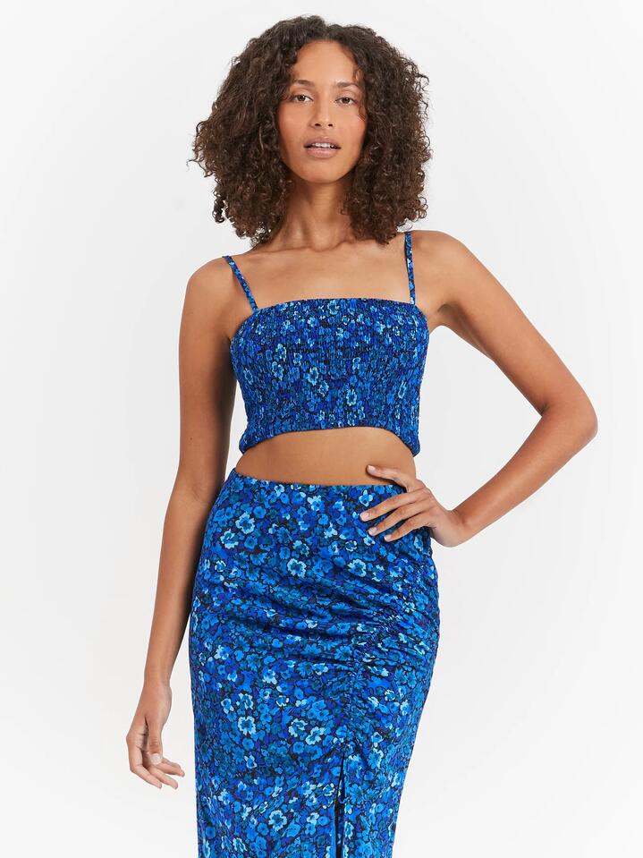 Image of a model wearing Tops. Productname: Lulu & Rose Elyna Shirred Top in Azure Floral colour by brand - Lulu & Rose